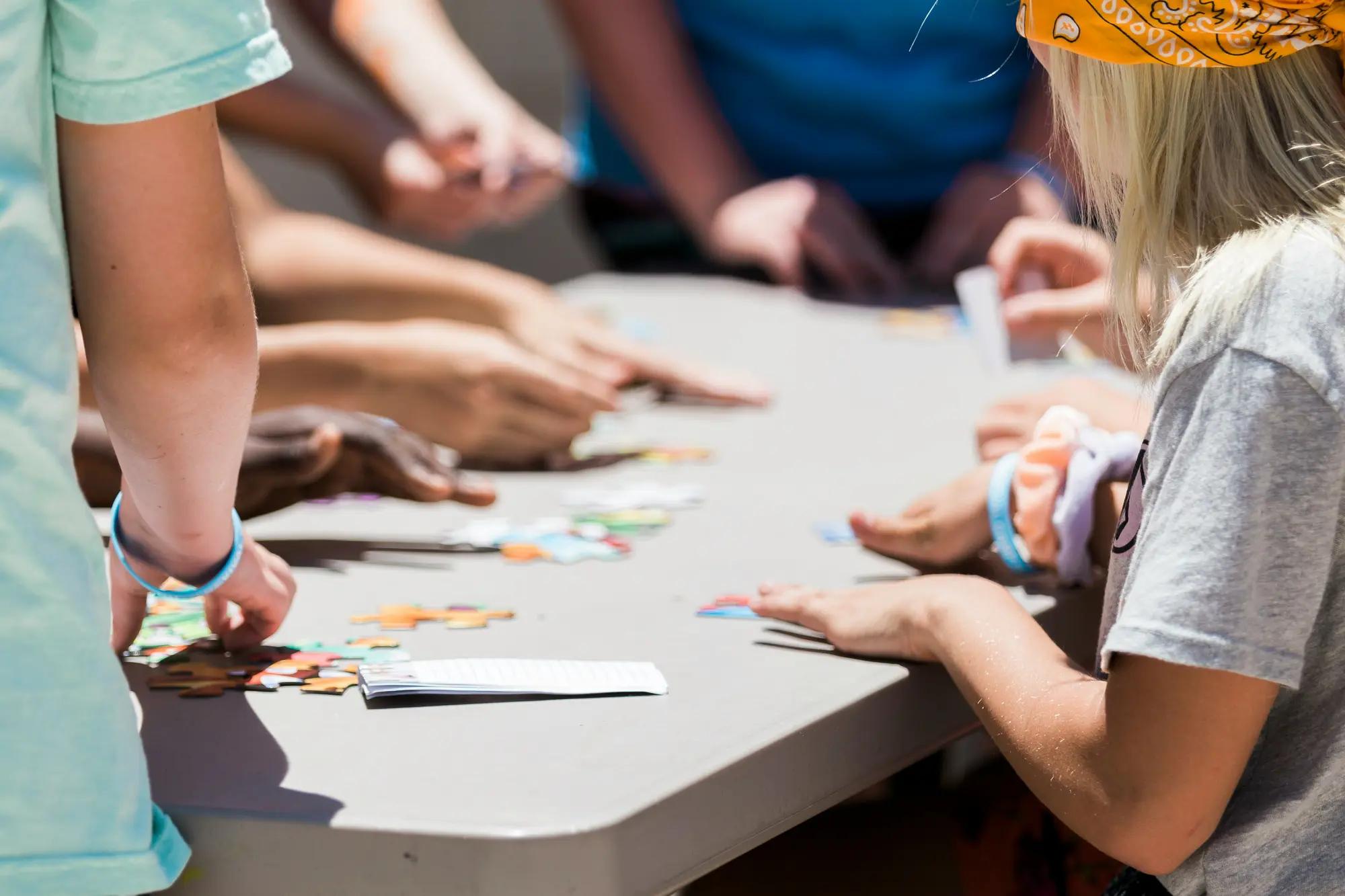 Children working on a craft around a table